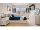 Bright bedroom with large windows providing ample natural light and modern decor at 336 Painted Horse Way, Erie, CO 80516