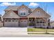 Beautiful two-story home boasts a three-car garage and manicured front lawn at 336 Painted Horse Way, Erie, CO 80516