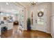Elegant foyer featuring hardwood floors, a view of the office, and lots of natural light at 336 Painted Horse Way, Erie, CO 80516