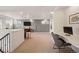 Spacious loft area featuring neutral carpeting, a built-in desk, and comfortable seating, perfect for relaxation at 336 Painted Horse Way, Erie, CO 80516