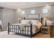 Serene main bedroom featuring a king-sized bed, bedside tables, and soft lighting for a relaxing ambiance at 336 Painted Horse Way, Erie, CO 80516