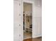 Mudroom with custom white built-in storage including shelving, hooks, and a bench at 336 Painted Horse Way, Erie, CO 80516