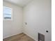 Neat laundry room featuring wood-style floors and utility connections at 1318 Sienna Peak Cir, Erie, CO 80516