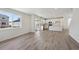 Spacious living area with wood floors, lots of light, and an island kitchen at 1318 Sienna Peak Cir, Erie, CO 80516