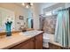 Traditional bathroom with a single sink vanity and a shower and tub combo at 17484 E 99Th Ave, Commerce City, CO 80022