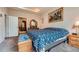 Spacious bedroom with a custom dresser, soft carpet, and well-lit with ample sunlight at 17484 E 99Th Ave, Commerce City, CO 80022