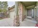 Welcoming front entrance featuring stone pillars, house number, and a cozy welcome mat at the front door at 17484 E 99Th Ave, Commerce City, CO 80022