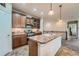 Well-equipped kitchen with granite countertops, stainless steel appliances, and a spacious island for food preparation at 17484 E 99Th Ave, Commerce City, CO 80022