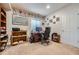 Comfortable home office with a desk, shelves, computer, and natural light from a bright window at 17484 E 99Th Ave, Commerce City, CO 80022