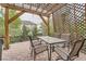 Charming patio featuring brick pavers, a covered pergola, and comfortable seating at 17484 E 99Th Ave, Commerce City, CO 80022