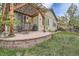 Backyard patio featuring an outdoor seating area, a grill, and a manicured lawn at 17484 E 99Th Ave, Commerce City, CO 80022
