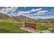 Mount Falcon Park entrance sign with scenic mountain views and clear blue sky at 7347 S Yank Ct, Littleton, CO 80123