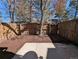 Fenced-in backyard with trees and bark mulch, perfect for outdoor enjoyment at 3061 W 92Nd Ave # 2D, Westminster, CO 80031