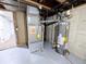 Basement mechanicals including furnace and water heater on painted floor at 3061 W 92Nd Ave # 2D, Westminster, CO 80031