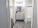 Bright bathroom featuring a vanity with modern fixtures and an adjacent shower with tiled backsplash at 3061 W 92Nd Ave # 2D, Westminster, CO 80031