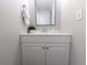 Neutral toned bathroom showcasing a corner vanity, mirror and towel rack at 3061 W 92Nd Ave # 2D, Westminster, CO 80031