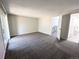 Bright bedroom featuring gray carpet with sliding glass door at 3061 W 92Nd Ave # 2D, Westminster, CO 80031