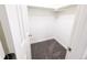 Walk-in closet featuring neutral carpeting, white walls, and a metal hanging rod for storage at 3061 W 92Nd Ave # 2D, Westminster, CO 80031