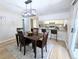 Open dining area with bar seating and view into the kitchen with stainless steel appliances at 3061 W 92Nd Ave # 2D, Westminster, CO 80031