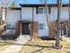 Charming townhome exterior featuring a well-maintained lawn and an inviting front entrance at 3061 W 92Nd Ave # 2D, Westminster, CO 80031