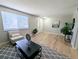 Inviting living room featuring wood-look floors and a comfortable layout at 3061 W 92Nd Ave # 2D, Westminster, CO 80031