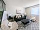 Cozy living room showcasing a comfortable seating arrangement and stylish decor at 3061 W 92Nd Ave # 2D, Westminster, CO 80031