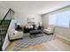 Spacious living area with plush seating, stylish rug, and ample natural light at 3061 W 92Nd Ave # 2D, Westminster, CO 80031