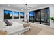 Brightly lit bedroom with many windows, deck access, and fireplace at 1601 S Columbine St, Denver, CO 80210