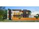 Contemporary home with modern architectural details, a fenced yard, and ample natural light from large windows at 1601 S Columbine St, Denver, CO 80210