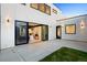 Exterior of modern home features large sliding glass doors leading to the patio and interior at 1601 S Columbine St, Denver, CO 80210