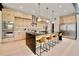 Bright, modern kitchen featuring a large island with bar seating, light wood cabinetry, and stainless steel appliances at 1601 S Columbine St, Denver, CO 80210