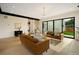 Modern living room with slider to back yard, fireplace, and neutral furnishings at 1601 S Columbine St, Denver, CO 80210