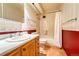 Clean bathroom with a tub and wood vanity at 6940 E Girard Ave # 203, Denver, CO 80224