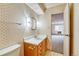 Clean bathroom with wooden vanity and shower at 6940 E Girard Ave # 203, Denver, CO 80224