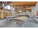 Game room with two pool tables and seating area at 6940 E Girard Ave # 203, Denver, CO 80224