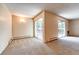 Living room with sliding doors leading to a patio at 6940 E Girard Ave # 203, Denver, CO 80224