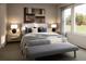 Relaxing main bedroom with a large window, bench, and a neutral color palette at 1929 Grayside Cir, Castle Rock, CO 80109