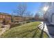 Landscaped backyard with a wooden fence and patio at 15008 Clayton St, Thornton, CO 80602