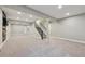 Spacious finished basement with carpet and a staircase at 15008 Clayton St, Thornton, CO 80602