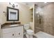 Updated bathroom with a glass shower door and granite vanity at 15008 Clayton St, Thornton, CO 80602