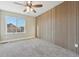 Modern bedroom with wood accent wall and ceiling fan at 15008 Clayton St, Thornton, CO 80602