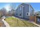 Two-story home with gray siding and a backyard at 15008 Clayton St, Thornton, CO 80602