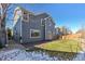 Gray siding two-story house with backyard at 15008 Clayton St, Thornton, CO 80602