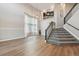 Spacious living room with hardwood floors and staircase at 15008 Clayton St, Thornton, CO 80602