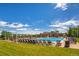 Community pool with lounge chairs and a clubhouse at 15008 Clayton St, Thornton, CO 80602