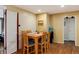 Small dining area with four chairs and hardwood floors at 2610 S Vine St, Denver, CO 80210