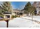 House exterior showcasing a charming front yard in winter at 2610 S Vine St, Denver, CO 80210