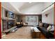 Open living room with vaulted ceiling and fireplace at 2610 S Vine St, Denver, CO 80210