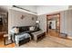 Living area with view into kitchen and hardwood floors at 2610 S Vine St, Denver, CO 80210