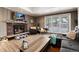 Living room with fireplace, large windows, and ample seating at 2610 S Vine St, Denver, CO 80210